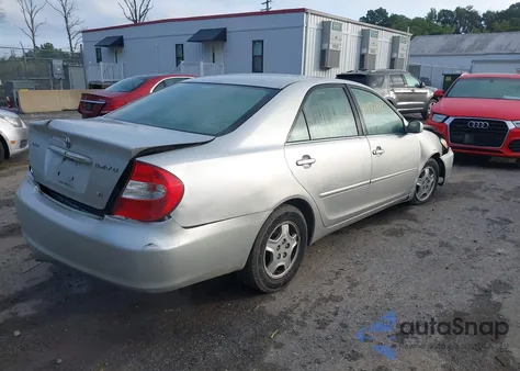 2003 Toyota Camry Le z USA, uszkodzony, nr VIN 4T1BF32K23U043478